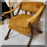F07. Oak campaign chair with barley twist legs and striped upholstery. 30”h x 25”w x 28”d 